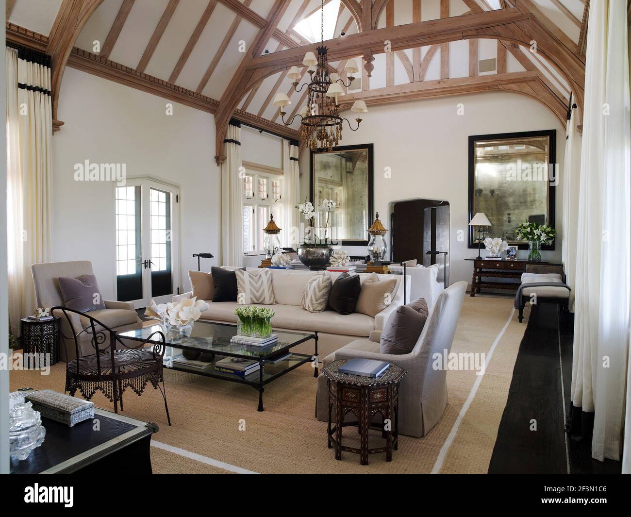 Seating around coffee table in spacious living room in USA home Stock