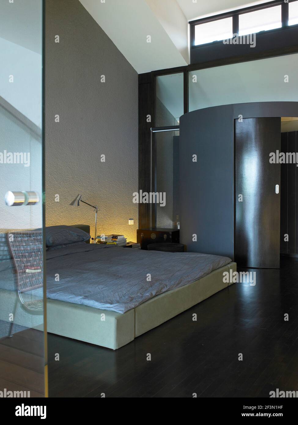 Double bed in spacious bedroom in Singaporean home Stock Photo Alamy