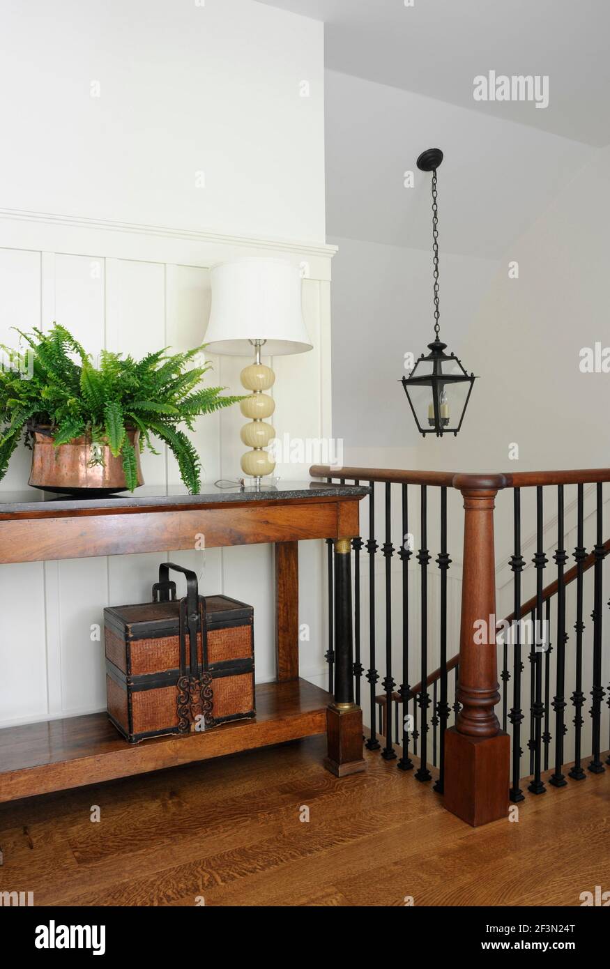 Wood console table on landing of Shelley Morris Designed Colonial style