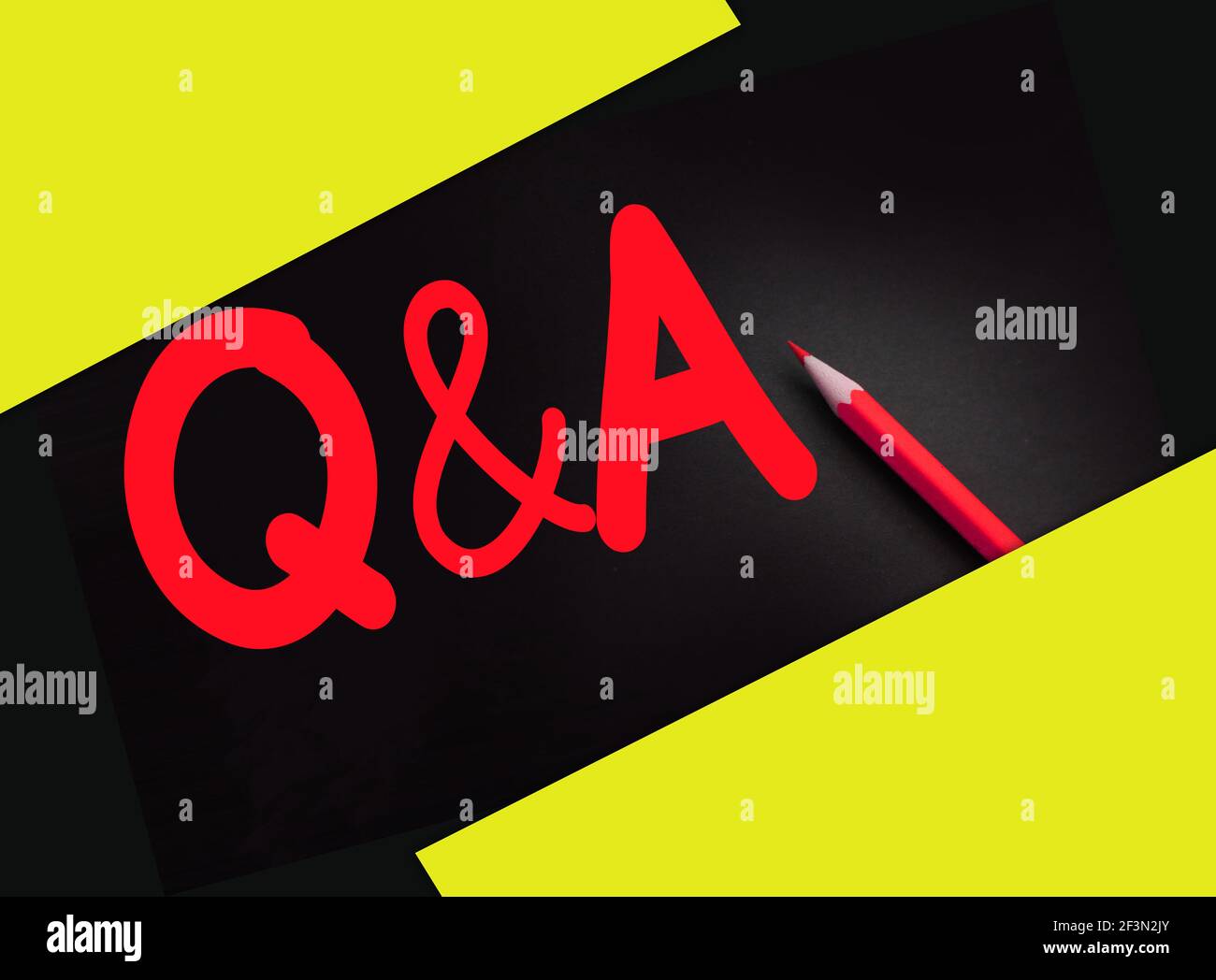 Yellow Pencil and Q and A written on black background Stock Photo - Alamy