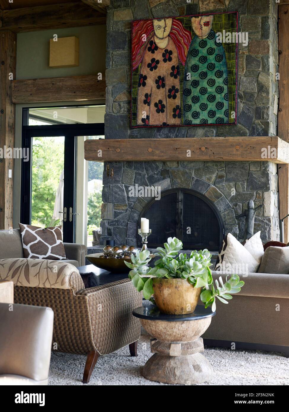Seating in front of fireplace in the great room in USA home Stock Photo