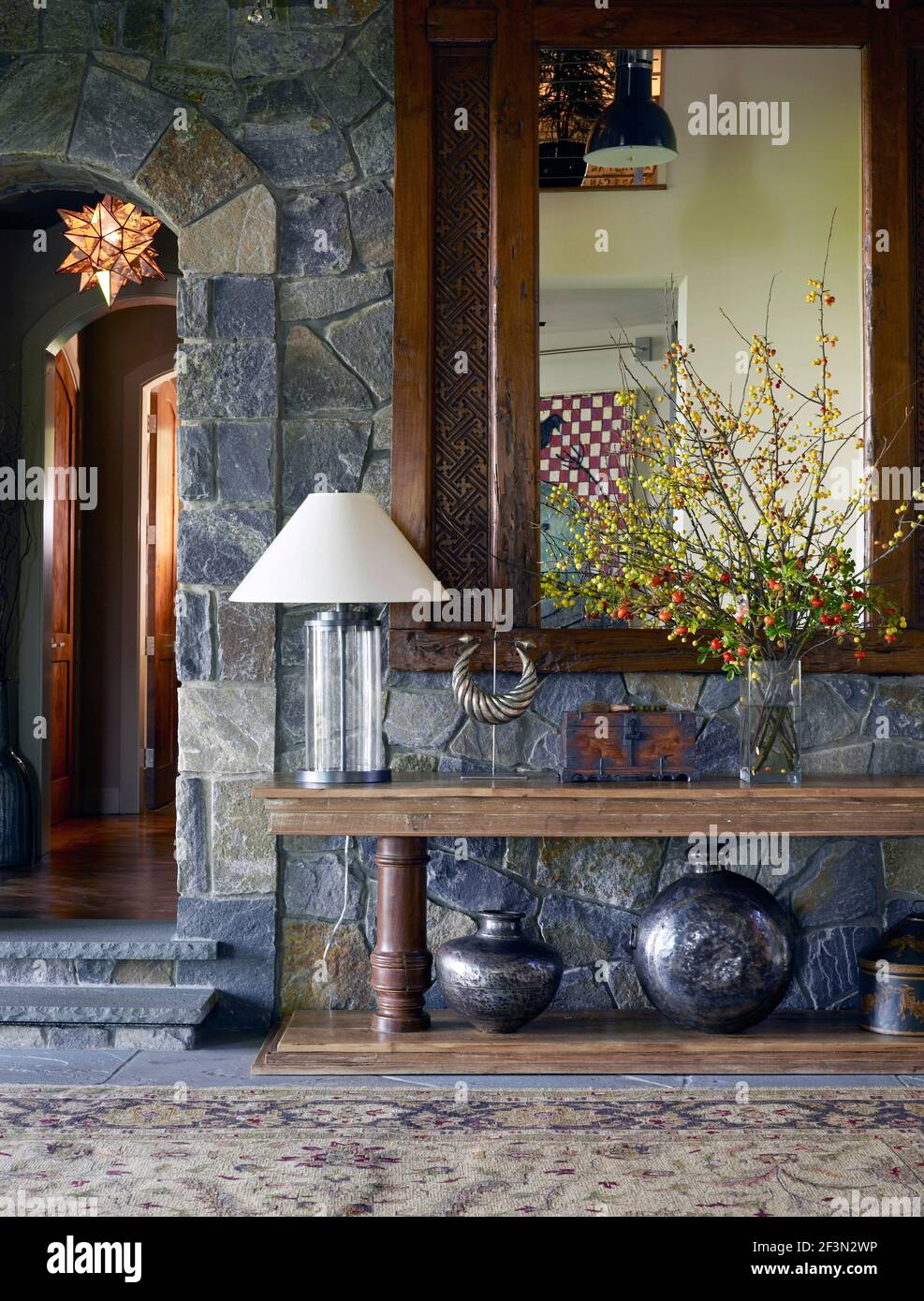 Wooden mirror above table in hallway of USA home Stock Photo Alamy