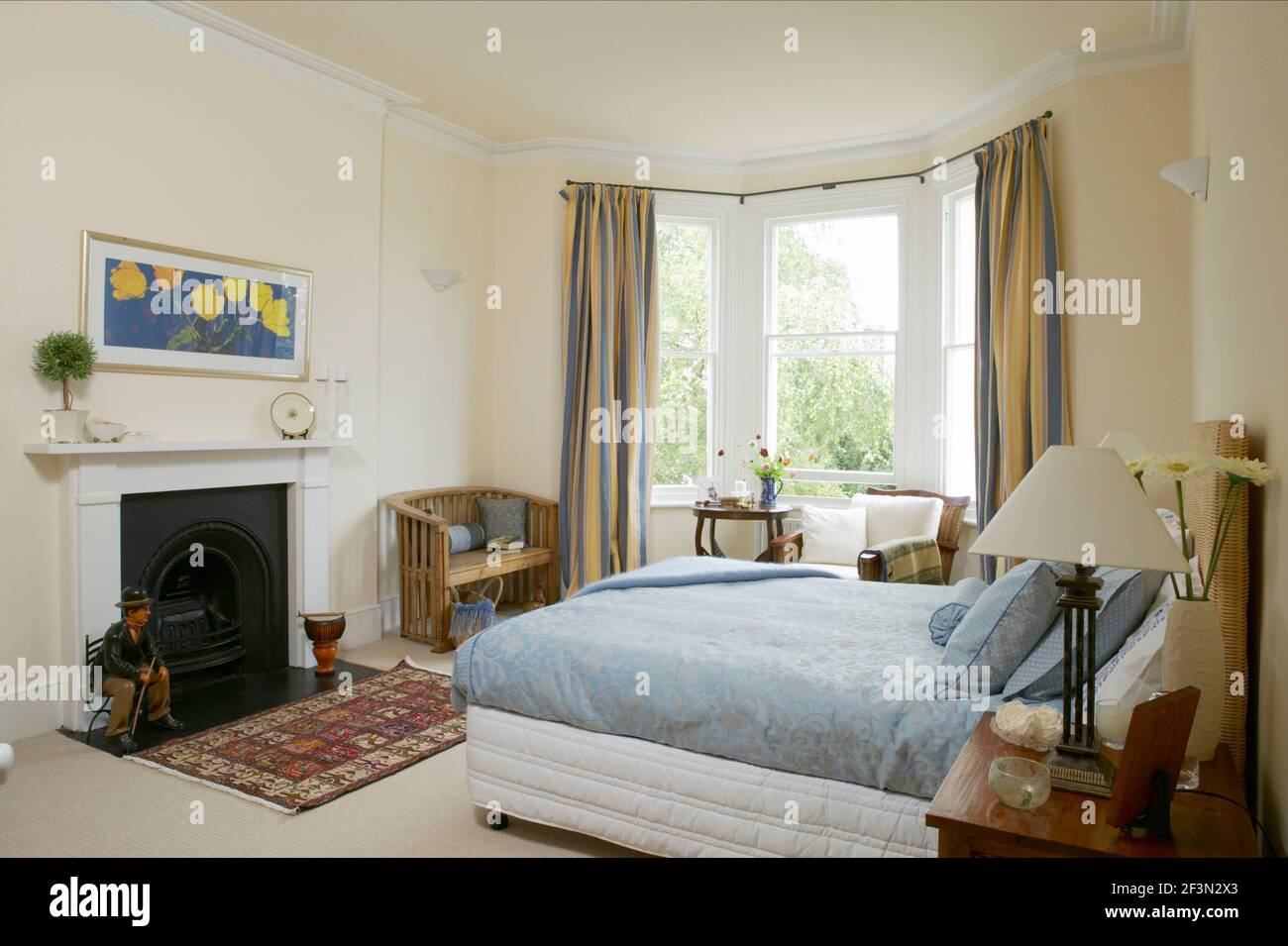 Traditional bedroom with double bed, bay window and fireplace Stock Photo Alamy