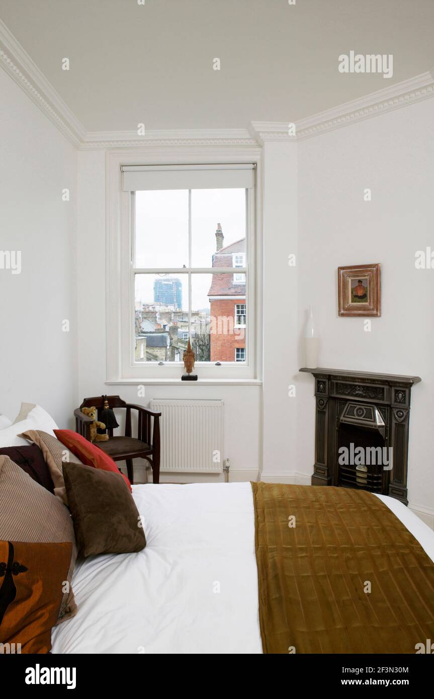 Victorian fireplace in white bedroom Stock Photo - Alamy