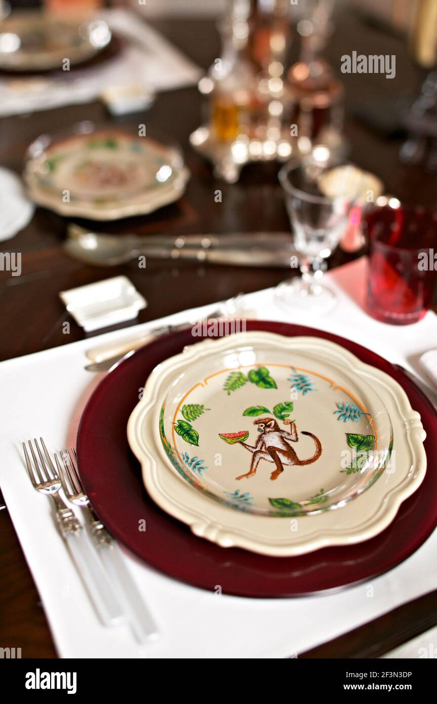 Place setting with monkey motif on plate Stock Photo