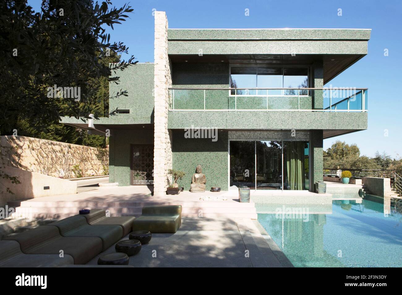 Exterior of modern house with green facade Stock Photo - Alamy