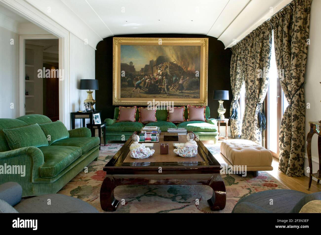 Seating around coffee table in traditional living room Stock Photo - Alamy