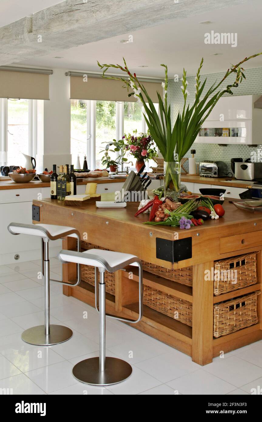 Bar stools at breakfast bar in spacious kitchen Stock Photo
