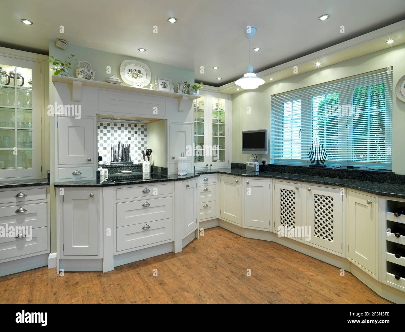 Traditional style kitchen with white units, UK home Stock Photo