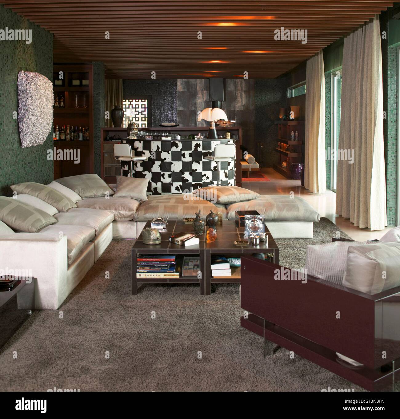 Seating around coffee table in modern living room Stock Photo - Alamy