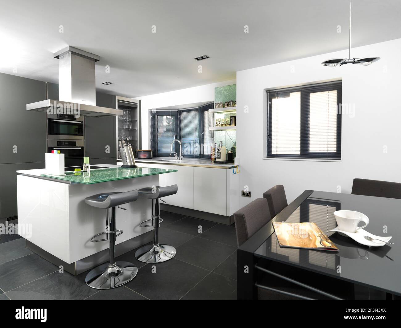 A modern open plan kitchen with central island, UK home Stock Photo