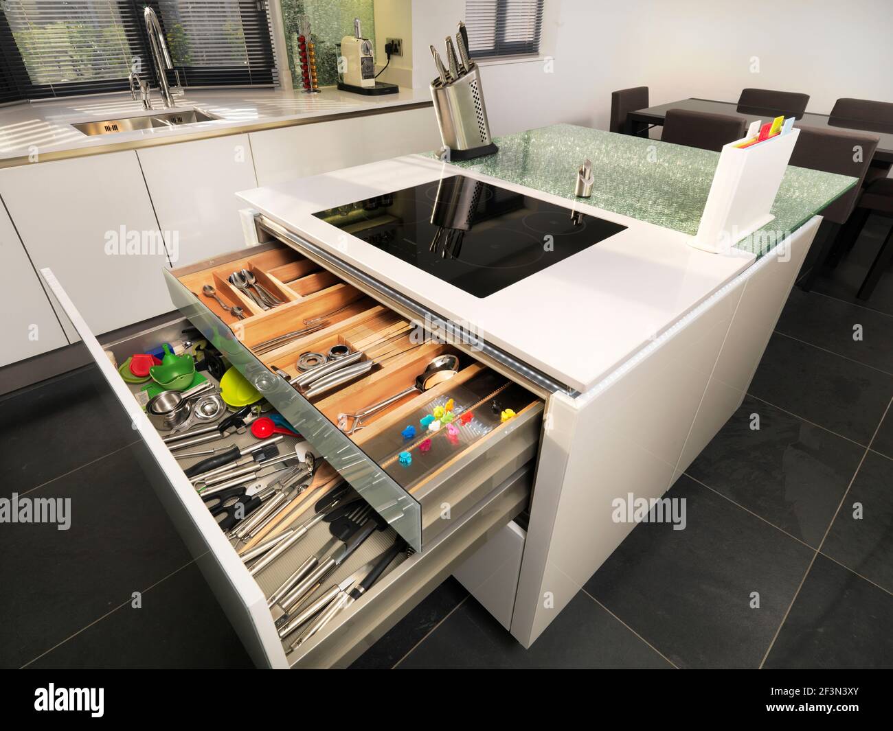 A modern kitchen central island with open drawer detail Stock Photo