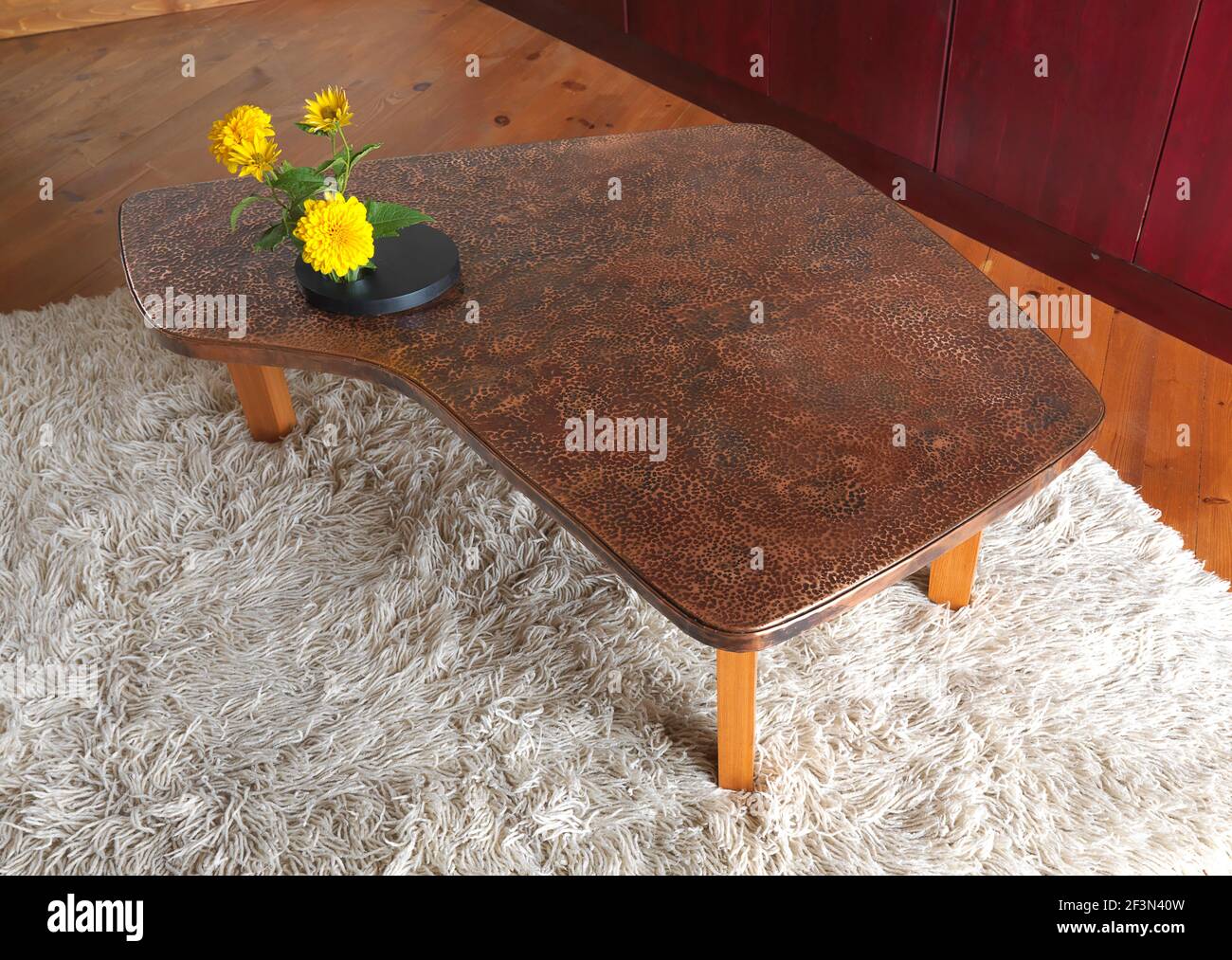 Copper topped coffee table, UK home Stock Photo - Alamy