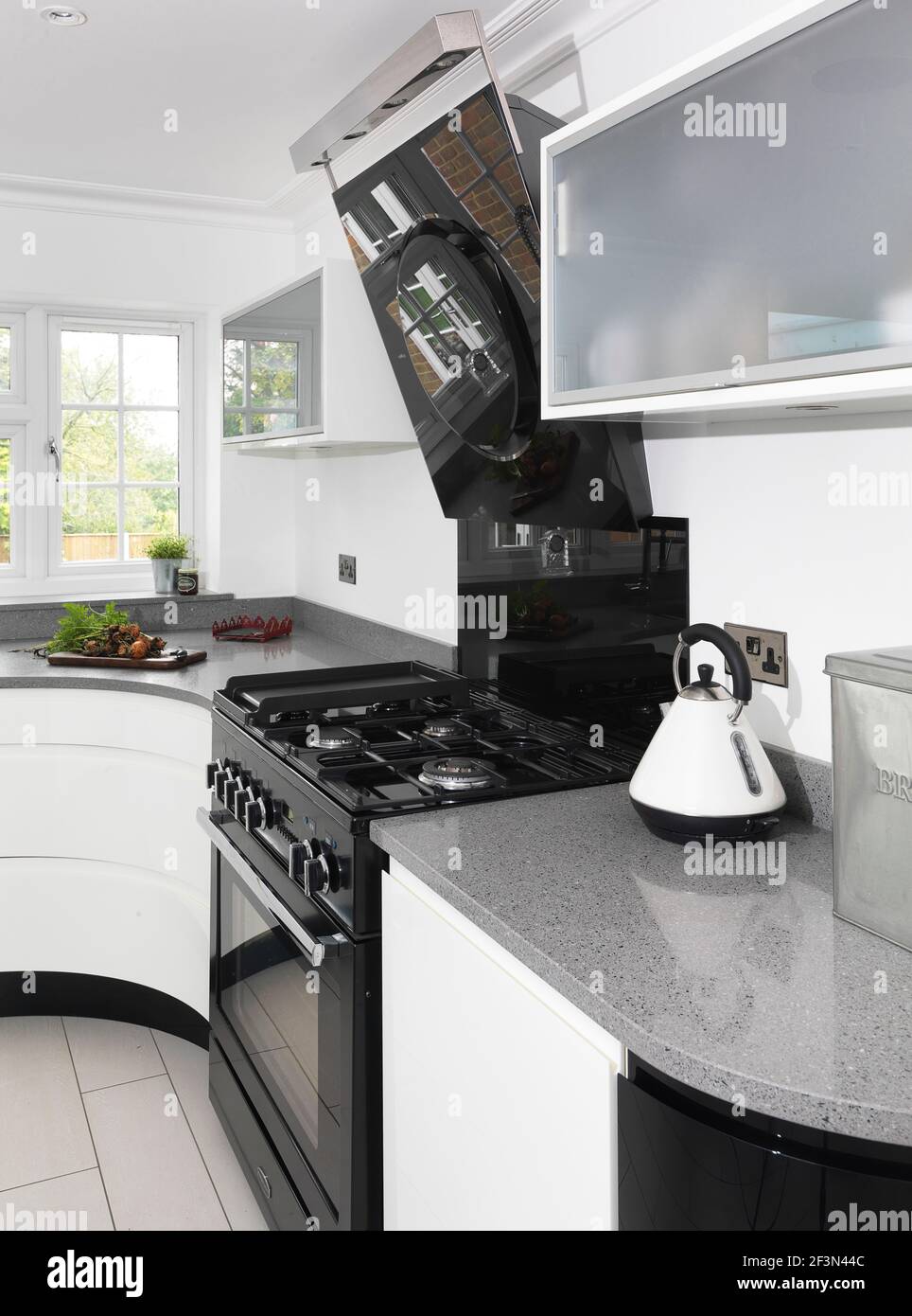 Modern black and white kitchen, UK home Stock Photo - Alamy