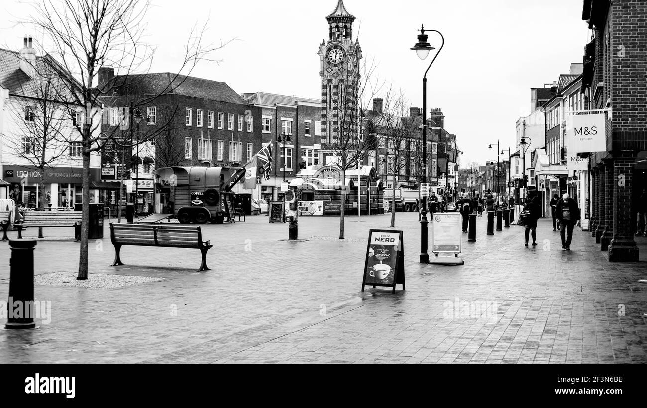 London UK, March 17 2021, Shoppers Walking Along High Street Shopping Area On A Wet Day during Lockdown Stock Photo