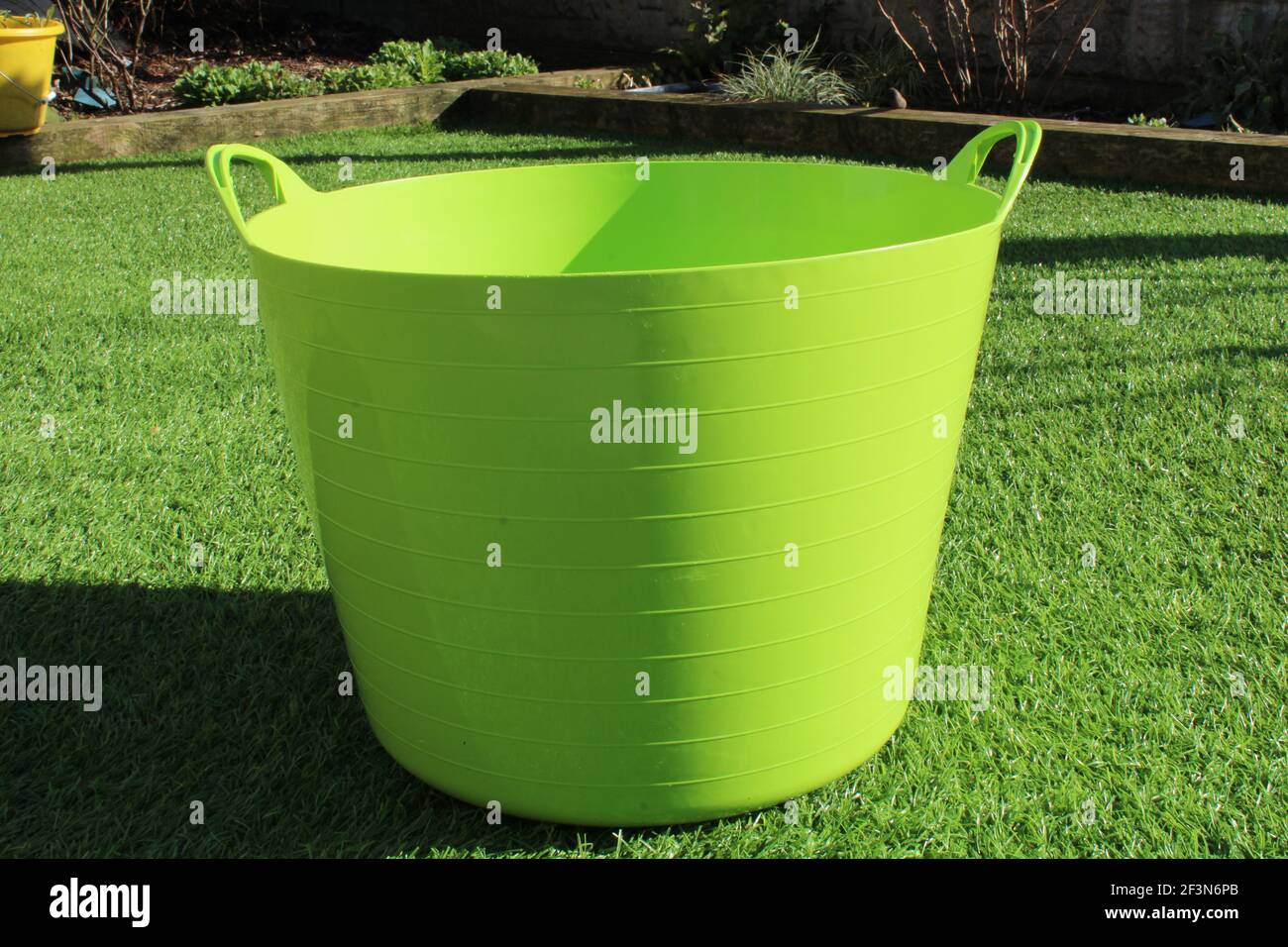 Large lime green ribbed garden tub Stock Photo