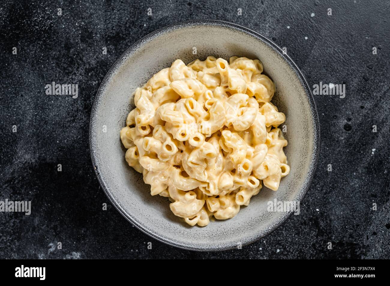 Mac and cheese american macaroni pasta with cheesy Cheddar sauce. Black