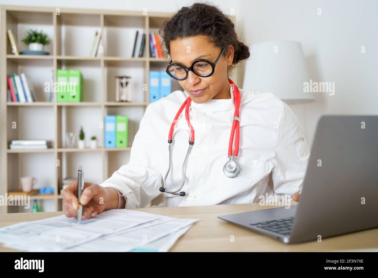 Doctor helping patient via telehealth making video call Stock Photo