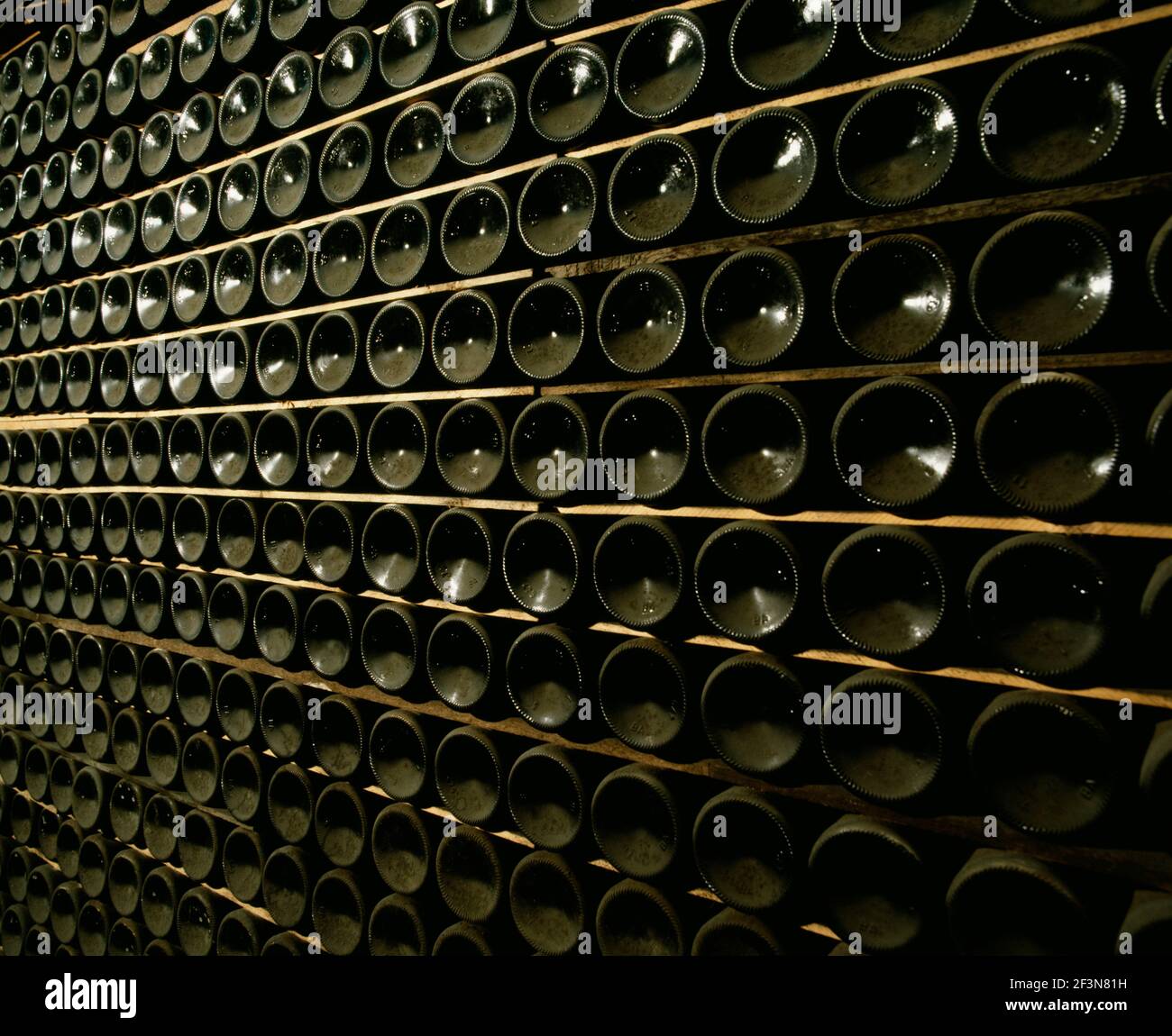 When stored in bottles for long periods of time, wine should be laid horizontally. Fine wines mature with age and can be stored for decades. Stock Photo