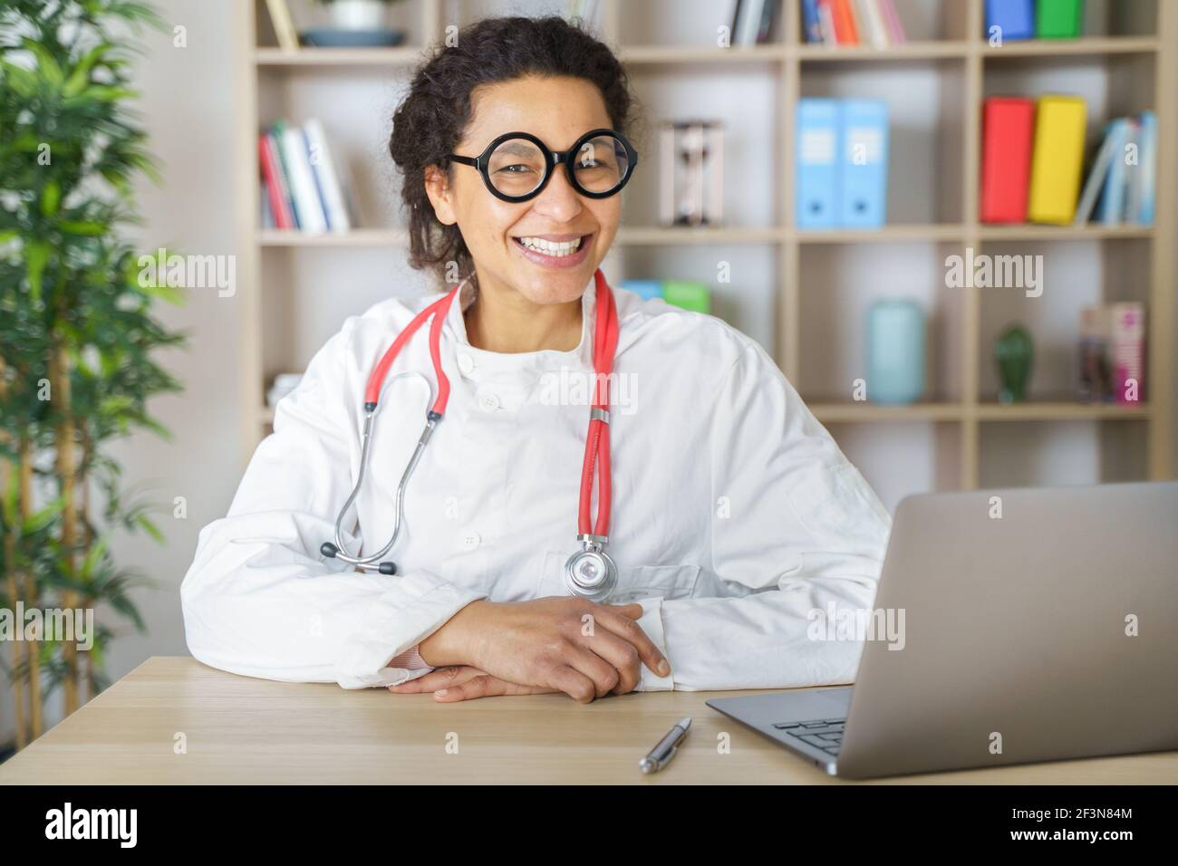 Doctor helping patient via telehealth making video call Stock Photo
