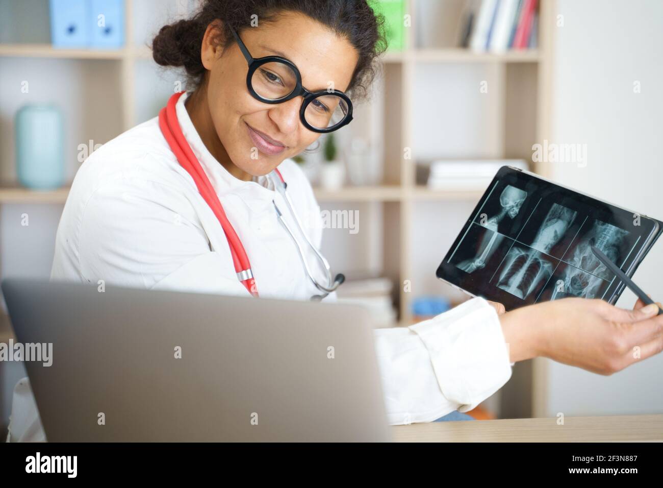 Doctor helping patient via telehealth making video call Stock Photo