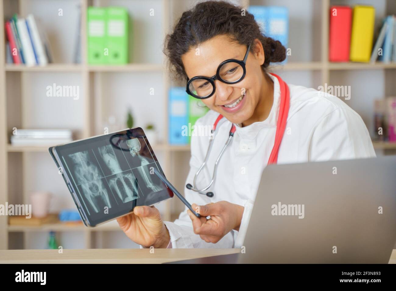 Doctor helping patient via telehealth making video call Stock Photo
