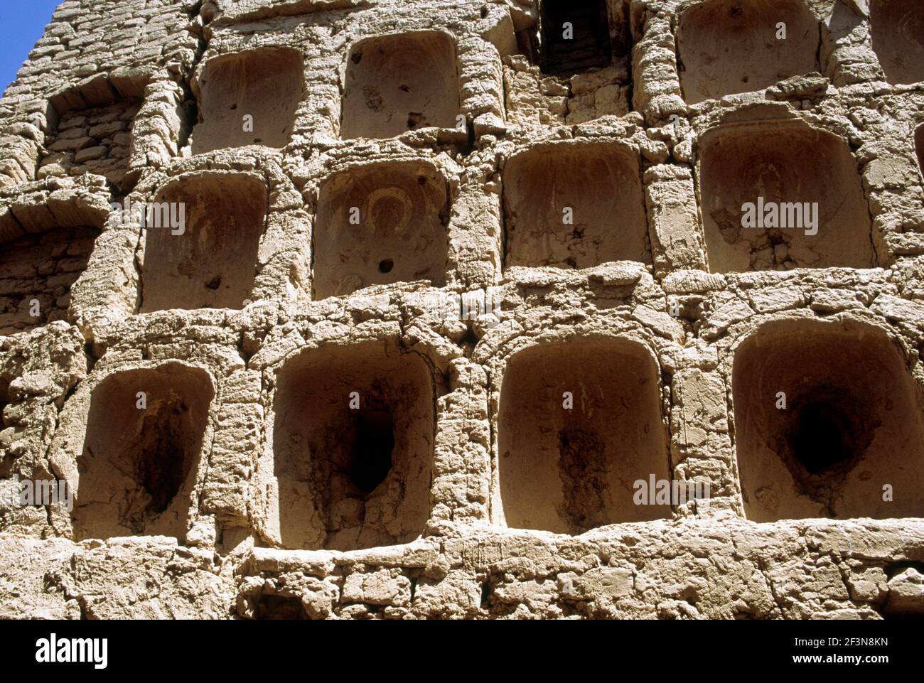 A series of brown stone arches or sconces in the Monastery walls of the ruins of ancient capital of Uigurs, or Uygurs, in the Flaming mountains on the Stock Photo