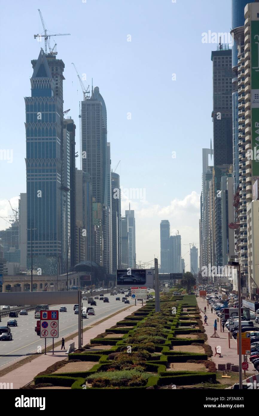 Sheikh Zayed Road is at the heart of the city in Dubai, and is a long straight avenue of tall buildings, and a multilane highway. Date shot May 2009. Stock Photo