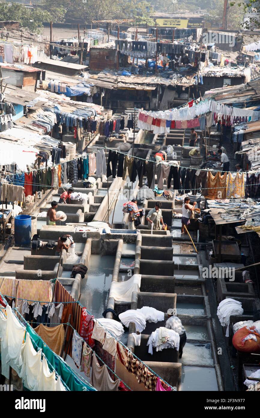 The Dhobi ghat laundries are special areas of the city, with row upon row of concrete wash pens, each fitted with its own flogging stone. Clothes sent Stock Photo