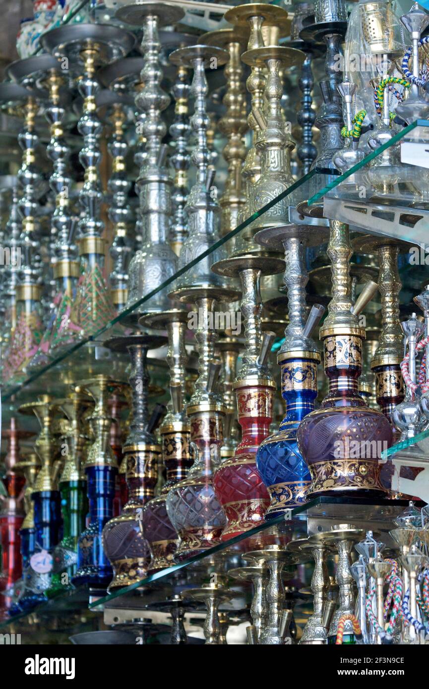 Hookah (water pipe) stall with an array of coloured glass bulbs with gold glaze on glass shelves in the Eminonu district Stock Photo