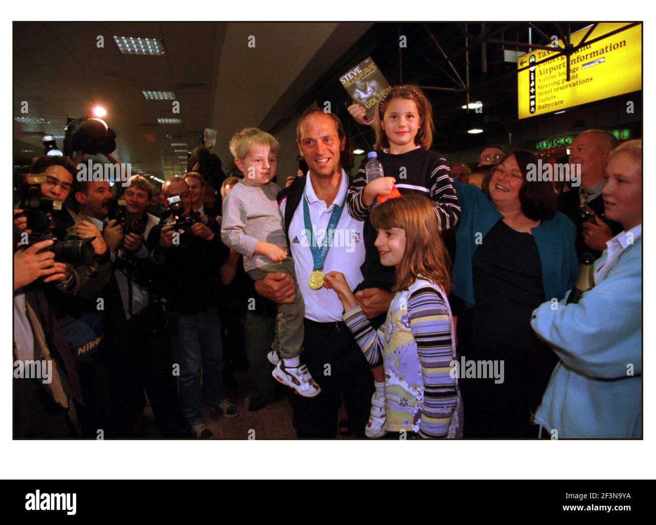 British Olympic Medalists arrive home at Heathrow airport....Steve Redgrave Coxless Four Rowing with family Stock Photo