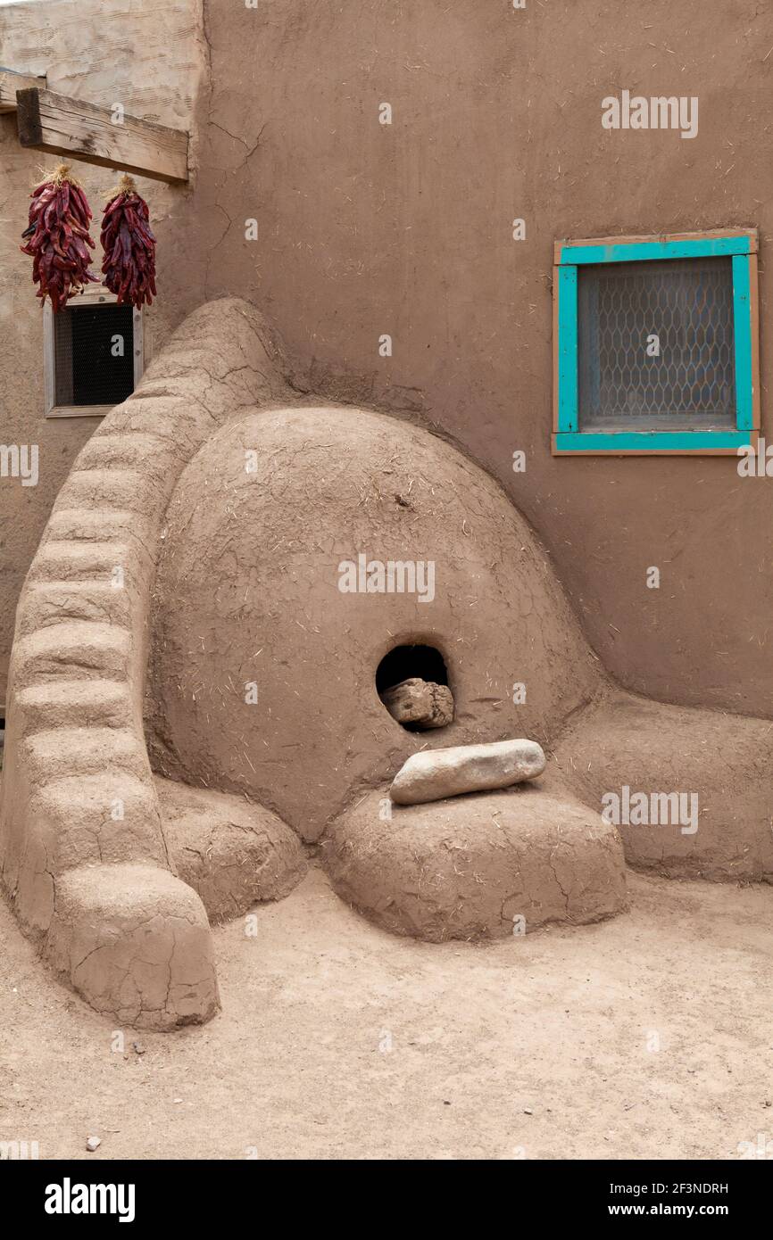 A traditional beehive-shaped adobe oven (Horno) in Taos Pueblo, New Mexico, USA. Stock Photo