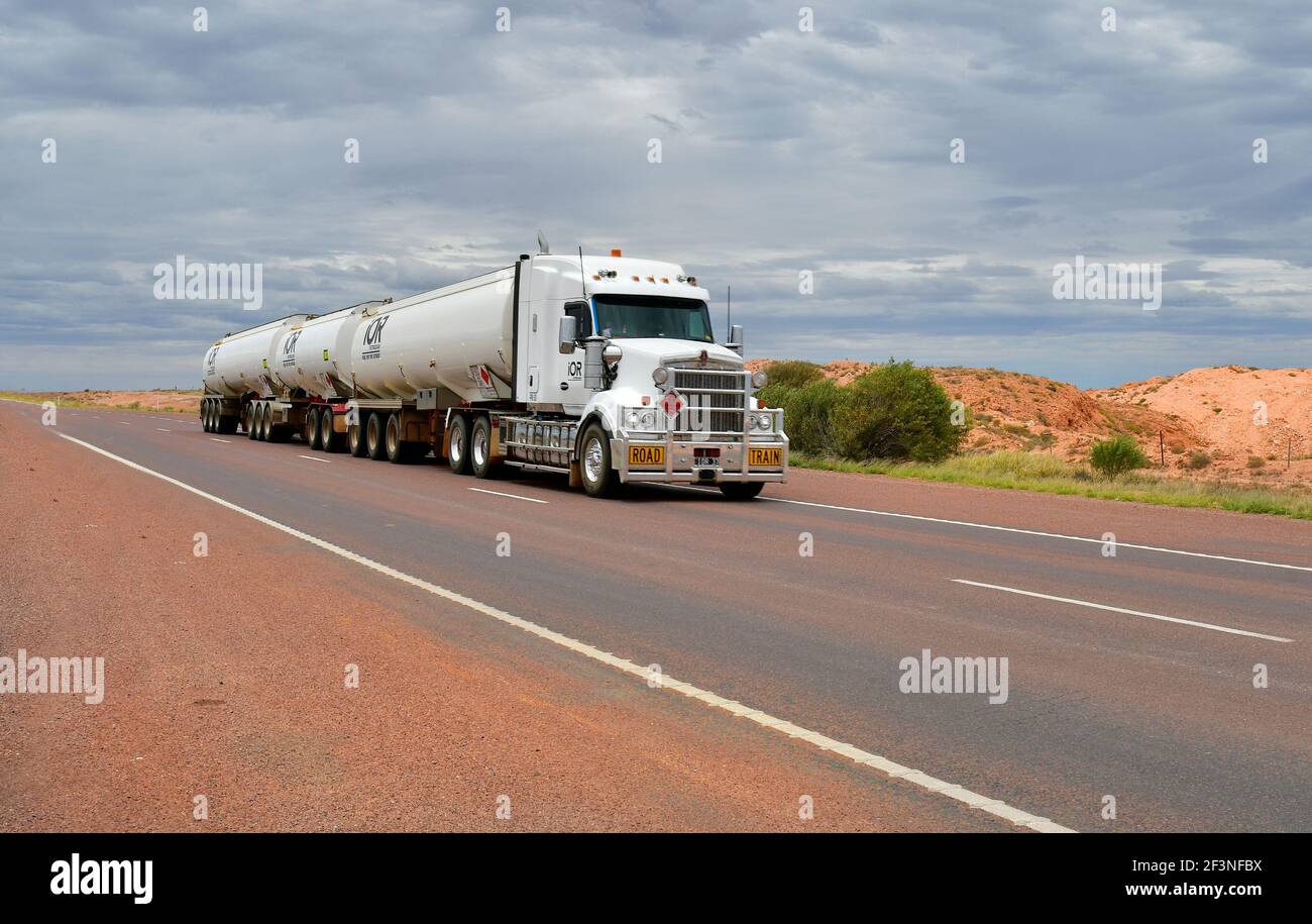Coober Pedy, SA, Australia - November 13, 2017: Truck with trailers on Stuart highway in South Australia Stock Photo