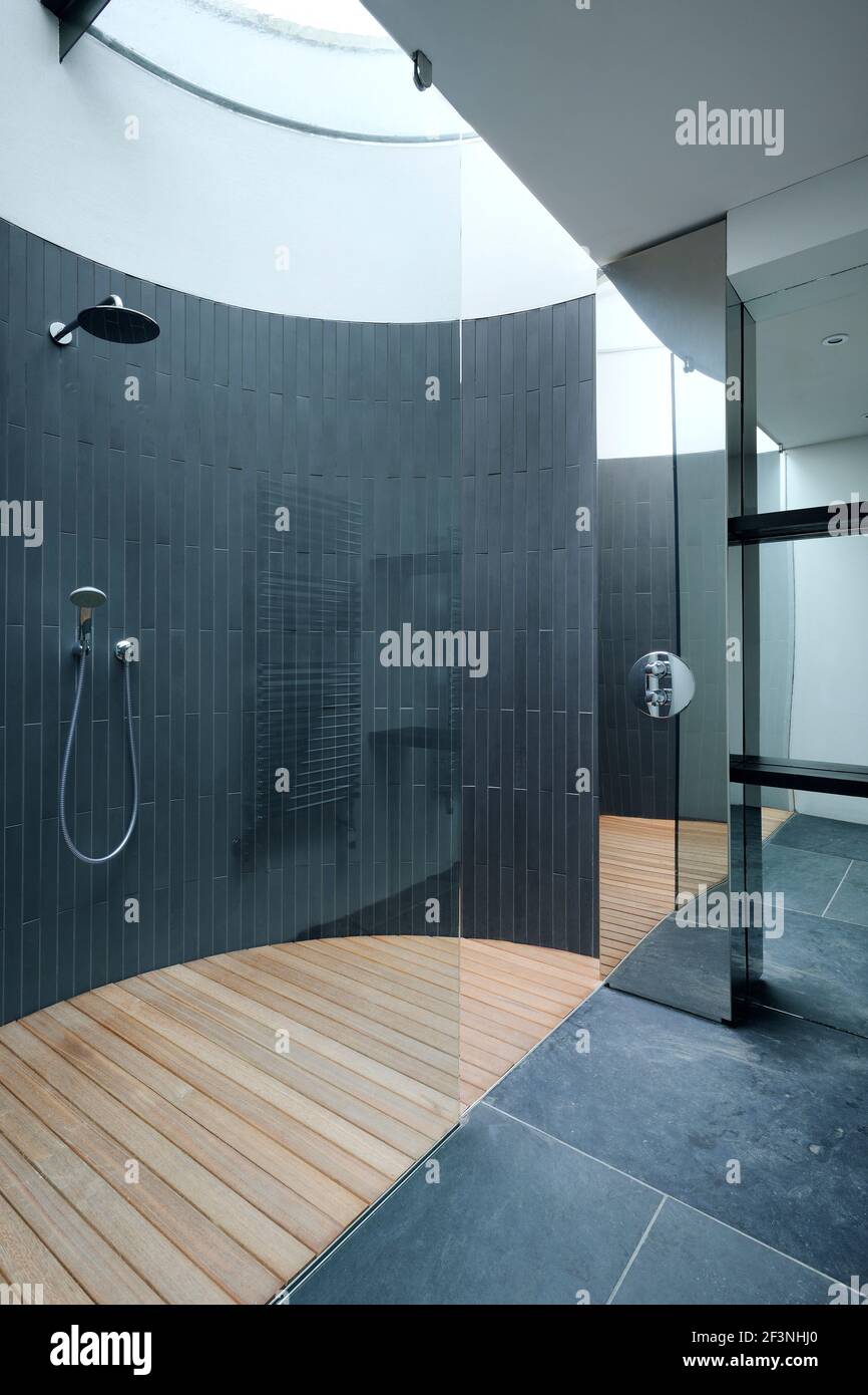 The circular slate lined shower between the garage and the entrance hall - Stan Bolt Architect (www.stanboltarchitect.com) Stock Photo