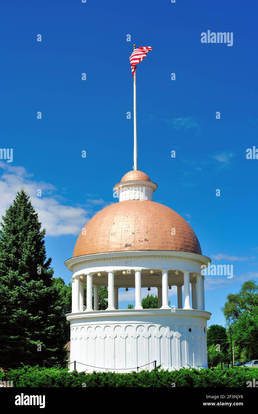 Zion, Illinois, USA. An American flag flies atop the dome remnant from the Elijah Hospice that