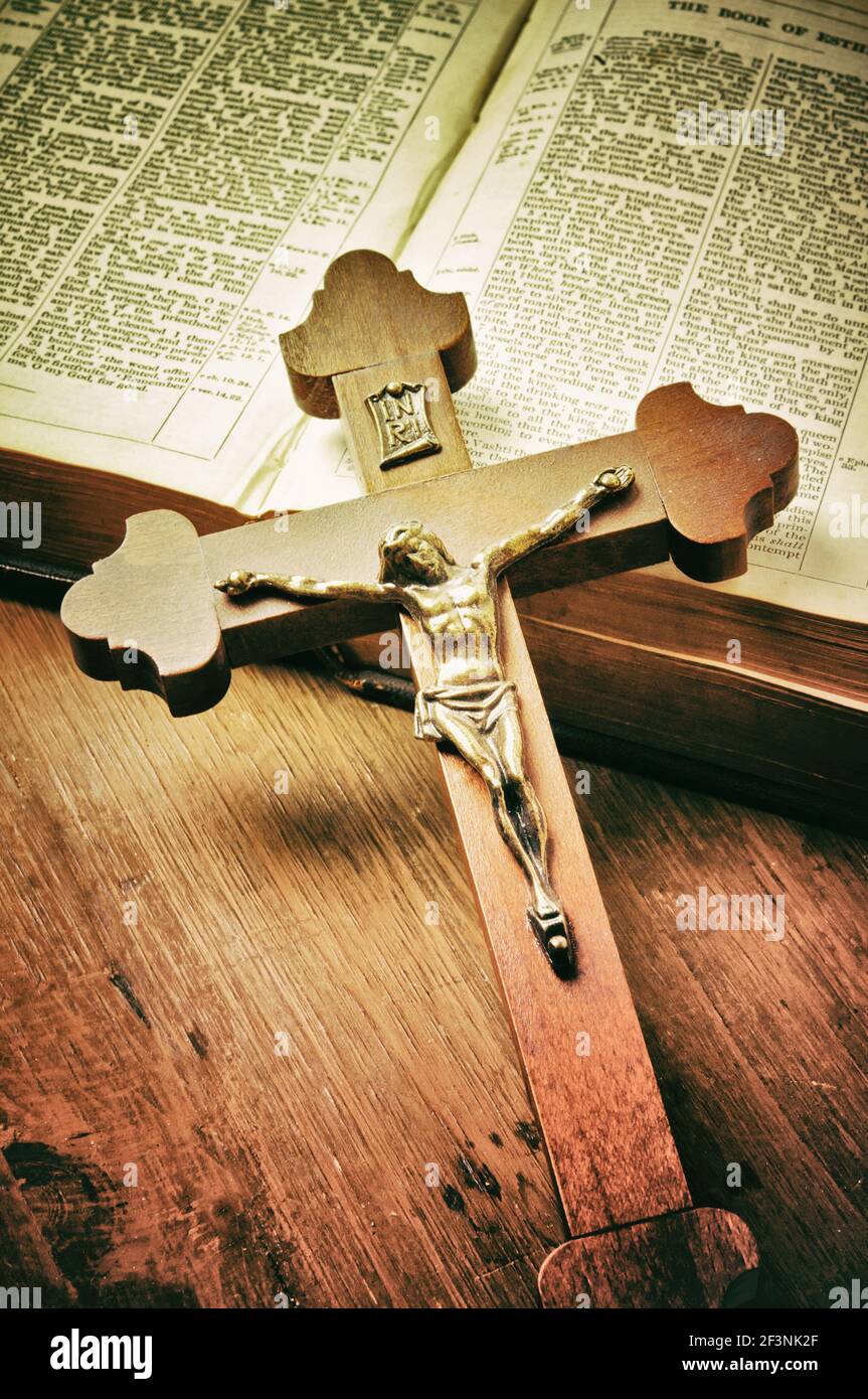 old Holy Bible book and wooden crucifix Stock Photo