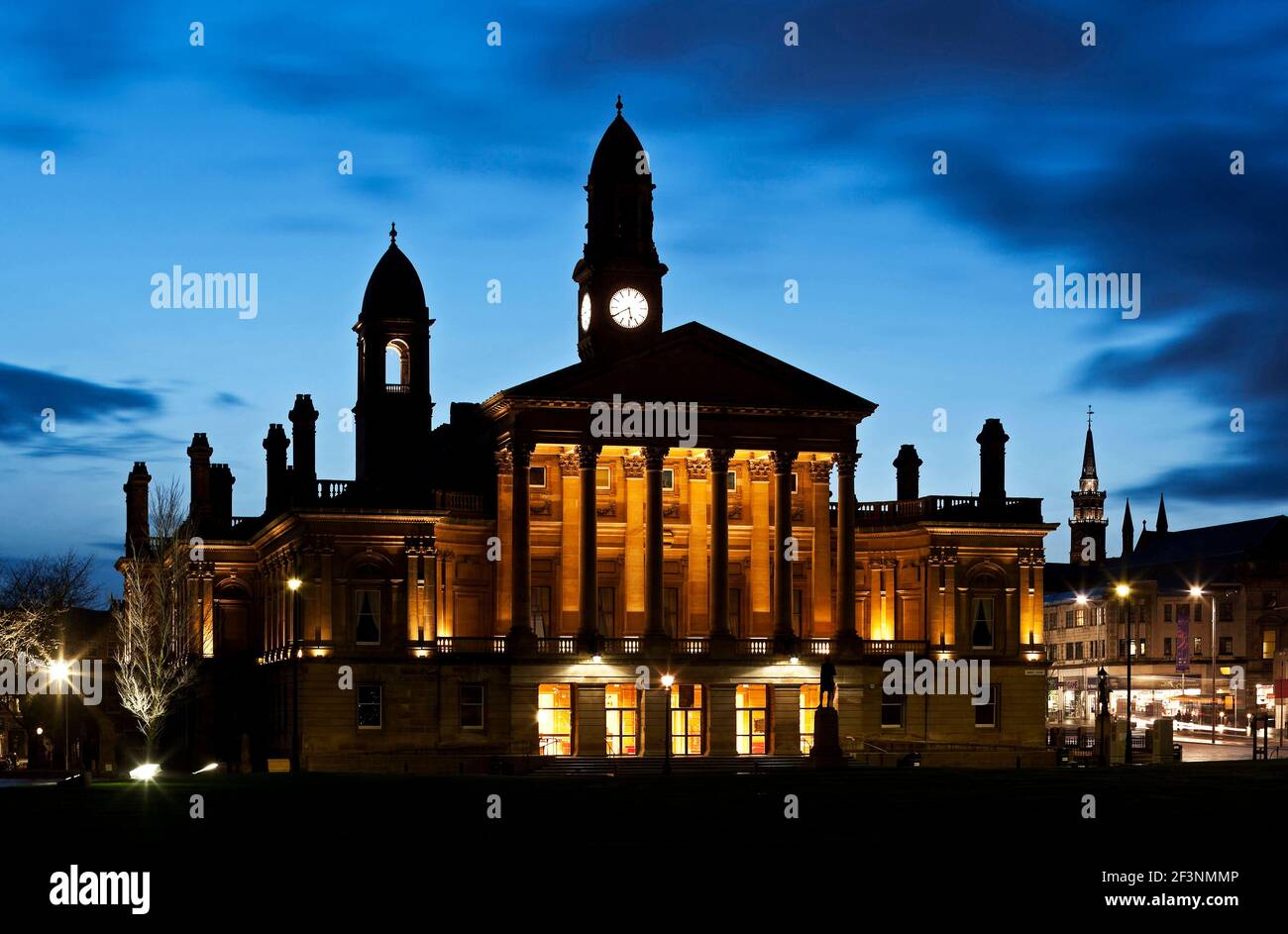 Paisley Town Hall. A 19th century building in the classical style, lit up at night. Towers and spires outlined against the night sky. Stock Photo