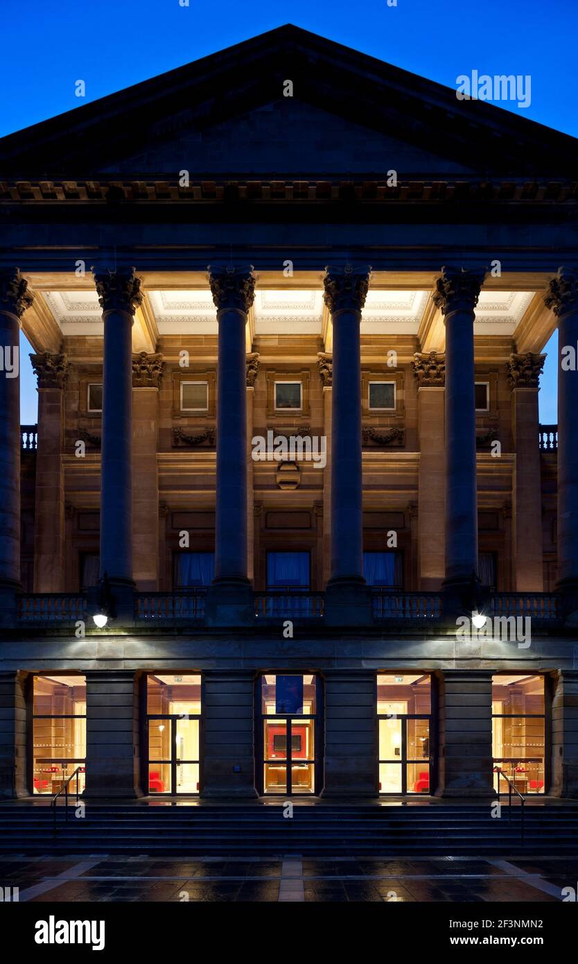 Paisley Town Hall. A 19th century building in the classical style with a pediment and columns on the front facade. Refurbished.  Lit up at night. Stock Photo