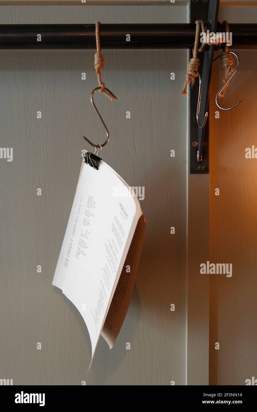 Menus hanging from a meat hook |  | Designer: Central Design Studio Stock Photo