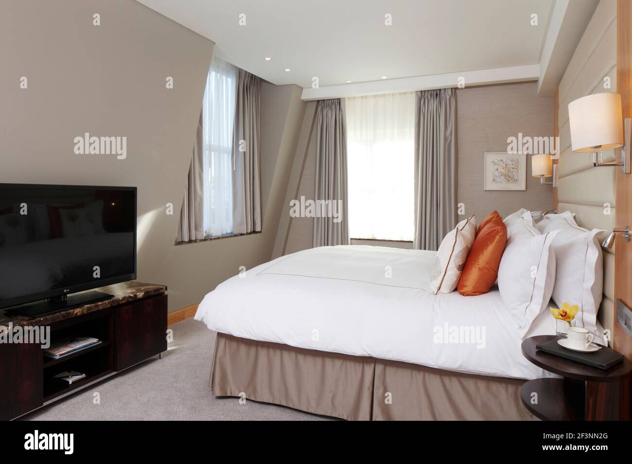 Hotel bedroom with padded headboard Designer RPW Stock Photo Alamy