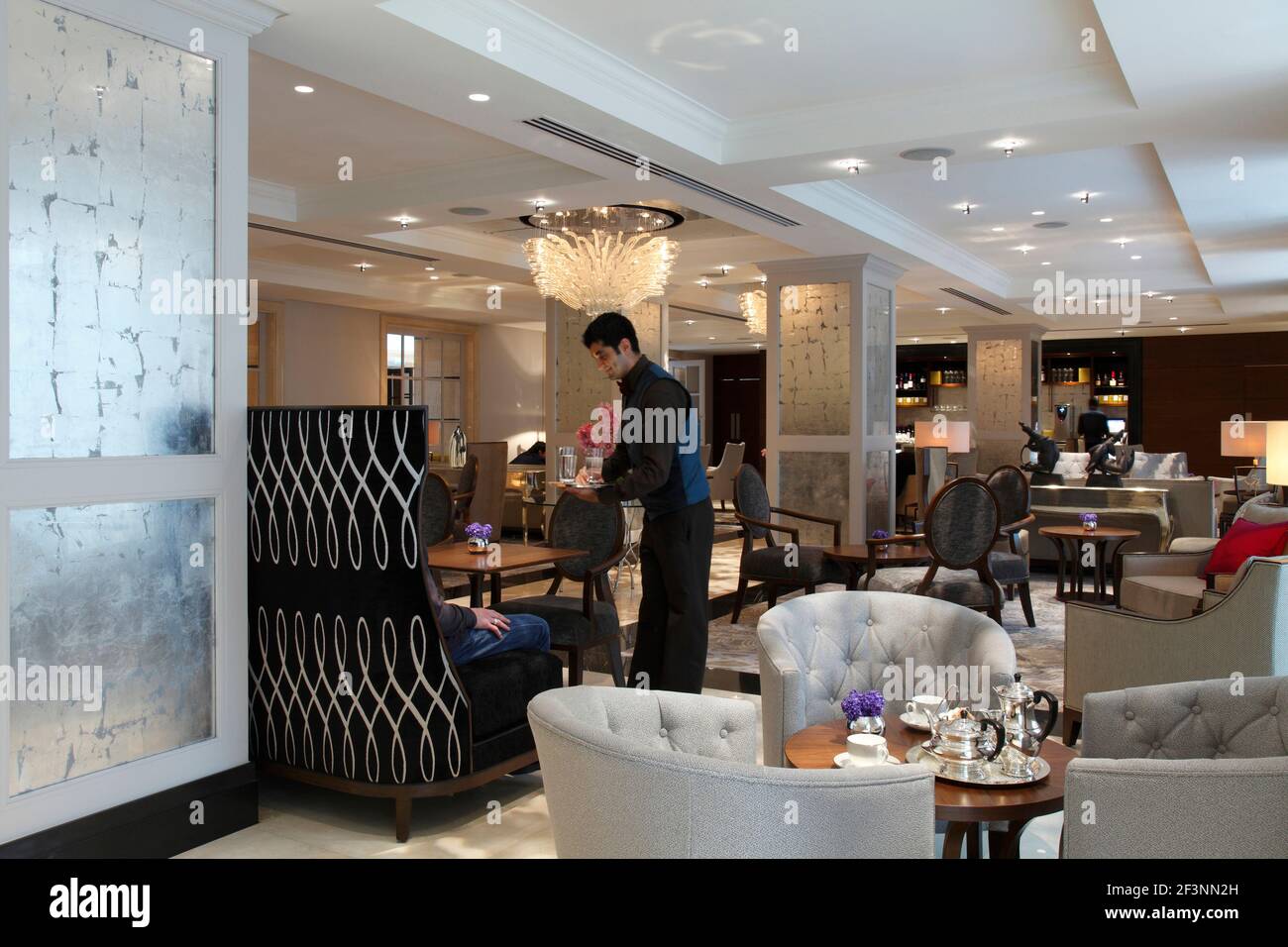 Waiter serving drinkss in lounge | | Designer: RPW Stock Photo - Alamy