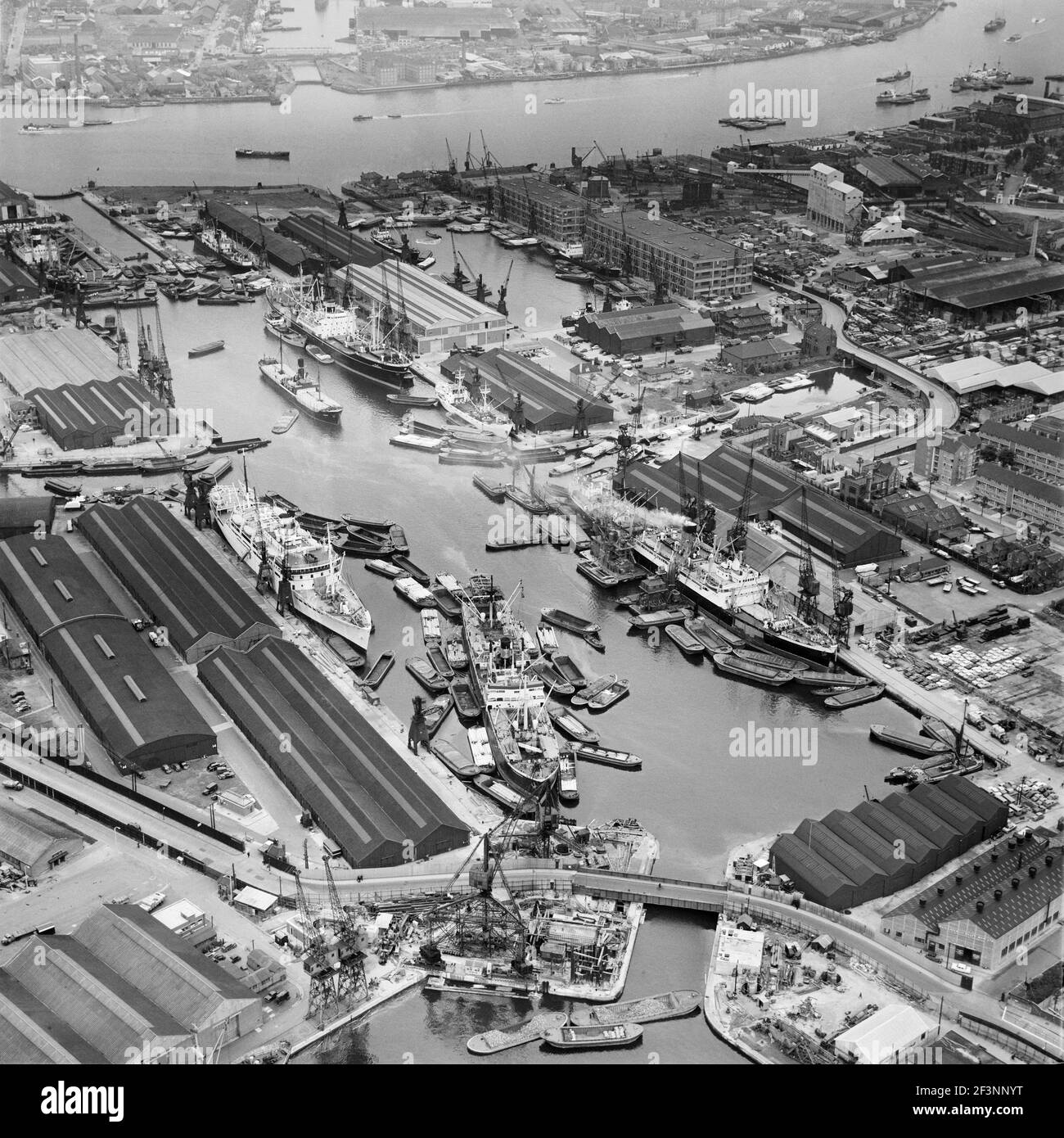 LONDON DOCKS, Southwark. Aerial photograph of Greenland Dock, Rotherhithe in June 1958. Also showing South Dock, the River Thames and the entrance to Stock Photo