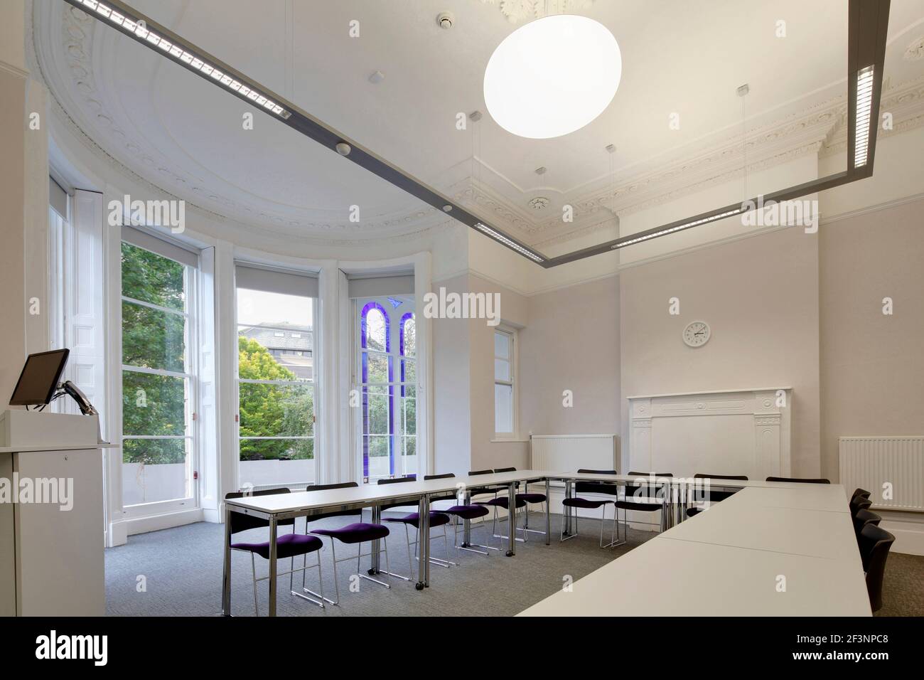 Tyndalls Park Road, Refurbishment of University Teaching and Administration Spaces. A room with a large screen, tables and chairs. Stock Photo