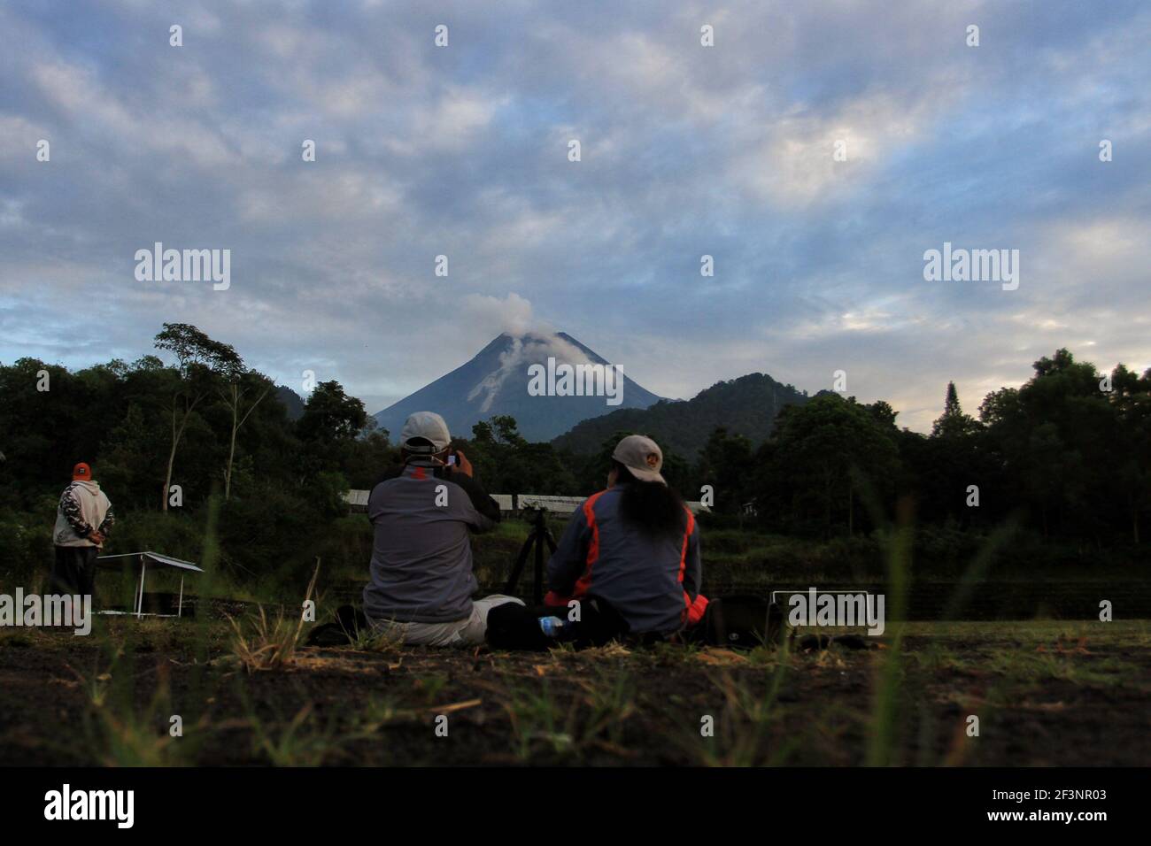 Indonesia most active volcano Mt. Merapi spews hot clouds Stock Photo ...