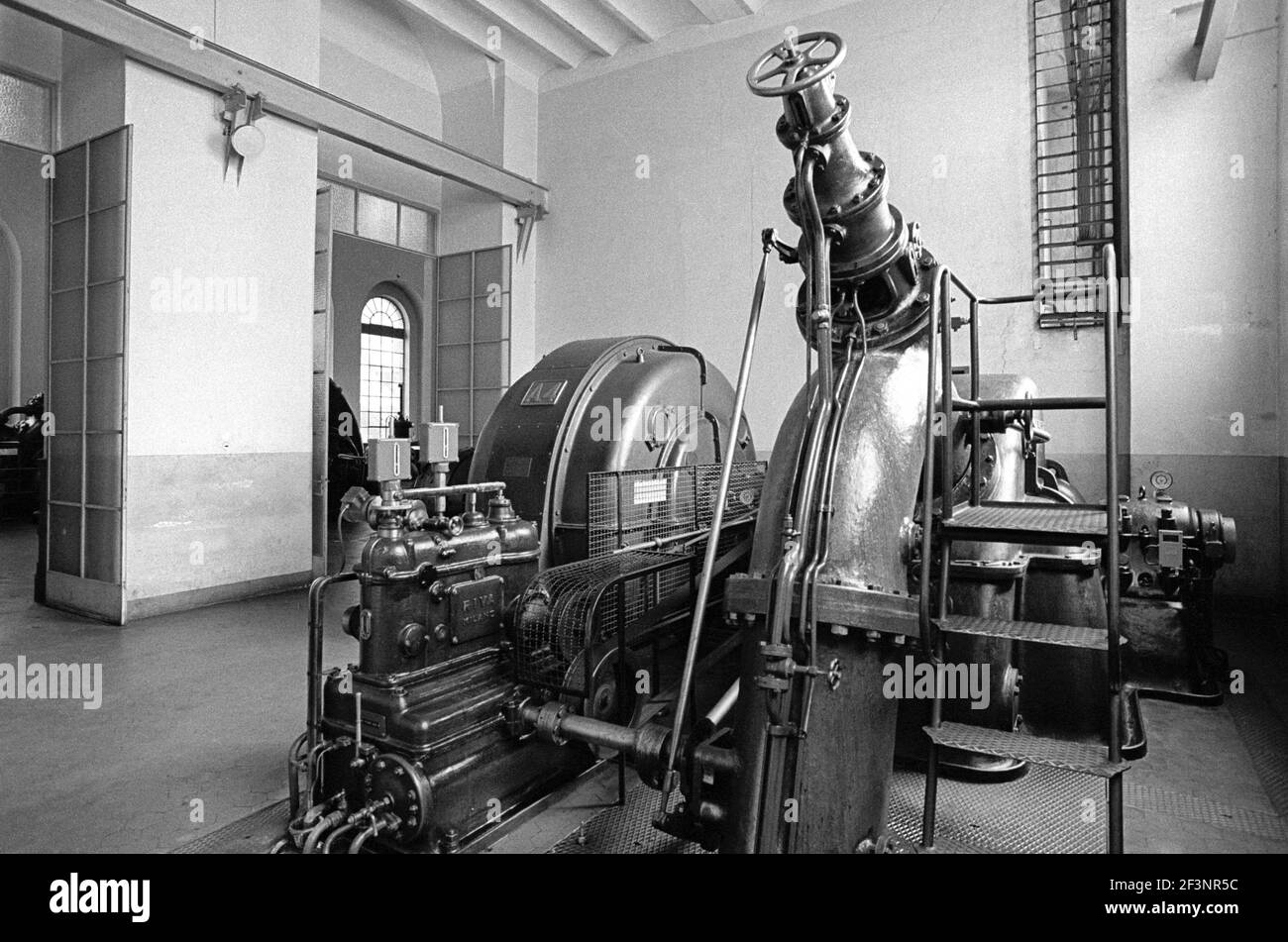 Old turbine room of 1910 year in Grosotto hydroelectric power station of AEM (Municipal Energetic Company of Milan, Italy) in Valtellina Stock Photo