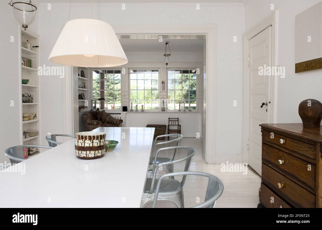 A refurbished open plan historic Georgian house, with white walls and floors, a holiday home furnished to a high standard. Traditional stile with mode Stock Photo