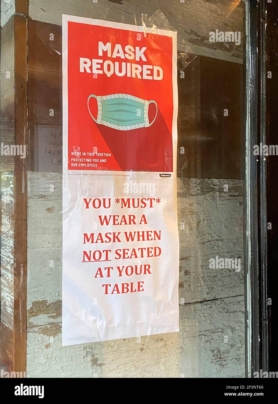 Mask Required sign posted on Restaurant window, Queens, NY Stock Photo