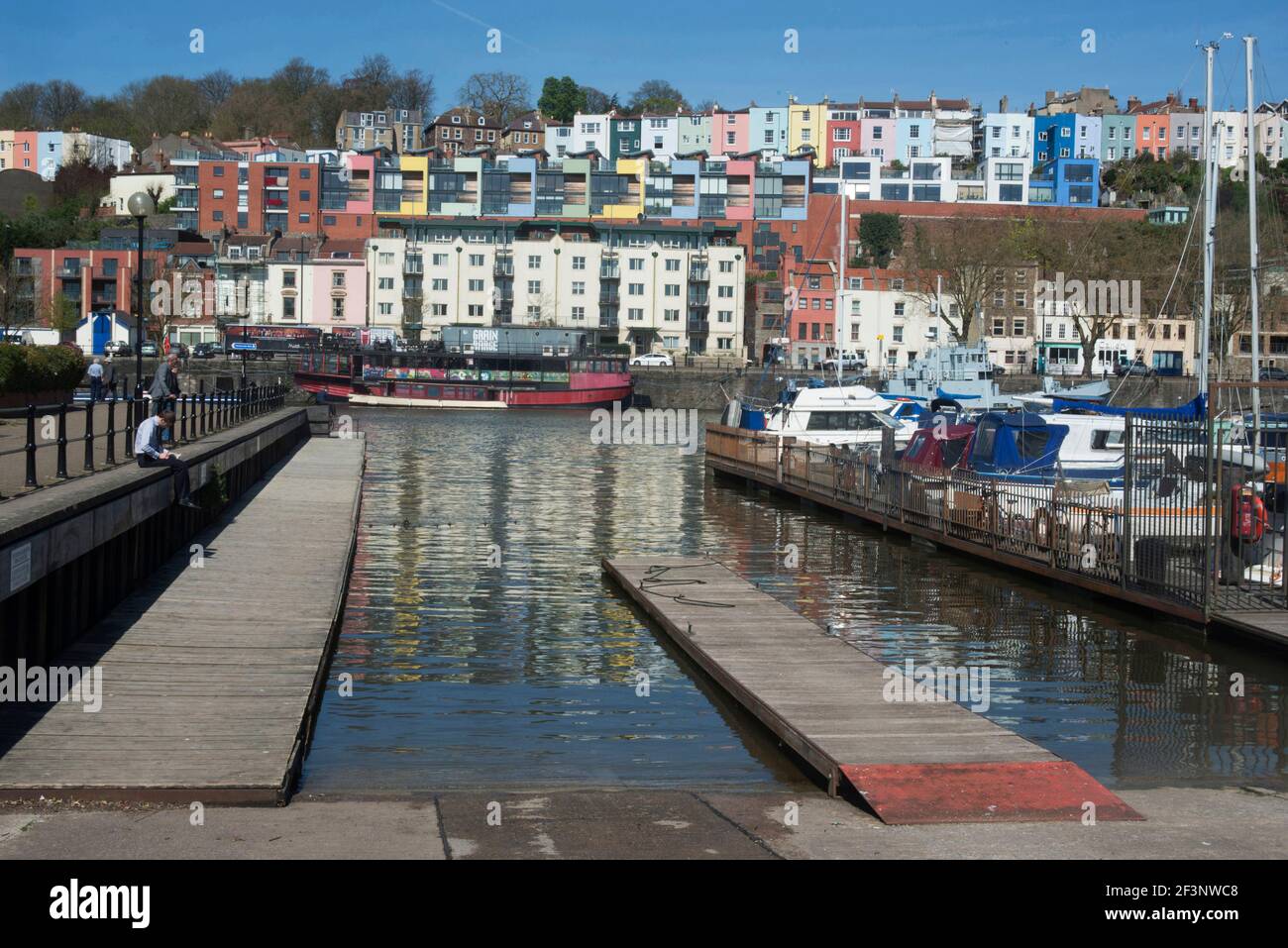 Along the Harbourside, Bristol. Mooring for boats, and terraced houses