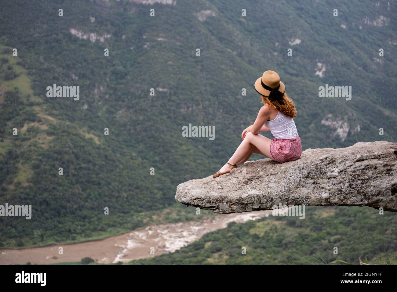 Girl posing on a rock Stock Photo