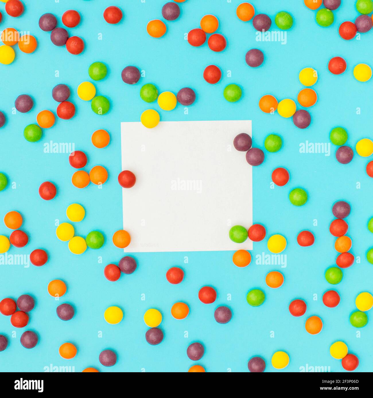 Small colorful balls around the copy space on blue background. Love